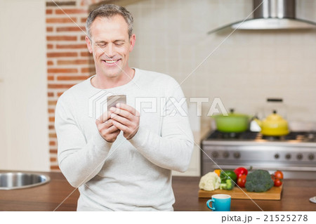 Handsome man looking at smartphone 21525278