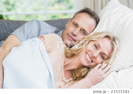 Cute couple napping on the couch Cute couple napping on the couch 21525581