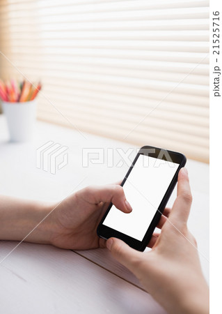 Close up view of businesswoman using her phone 21525716