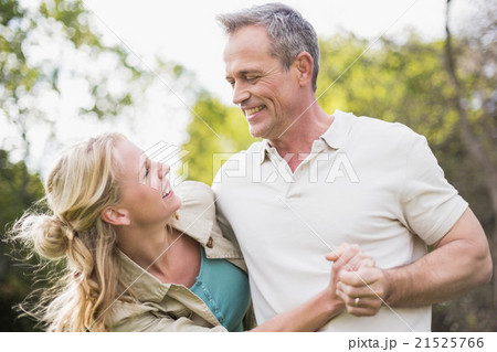 Cute couple dancing and holding hands Cute couple dancing and holding hands 21525766