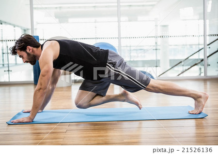 Muscular man doing push up on mat Muscular man doing push up on mat 21526136