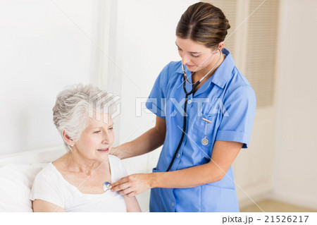 Doctor taking care of suffering senior patient Doctor taking care of suffering senior patient 21526217