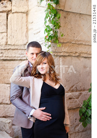 Man tenderly embraced Pregnant Woman 21531448