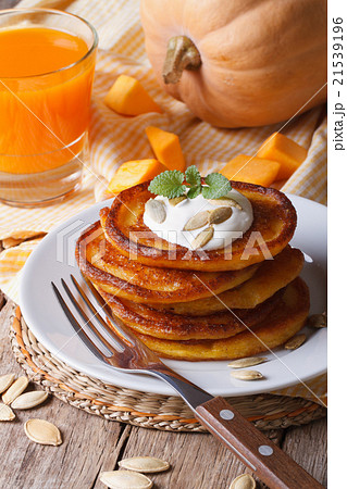 Pumpkin pancakes and juice closeup Pumpkin pancakes and juice closeup 21539196