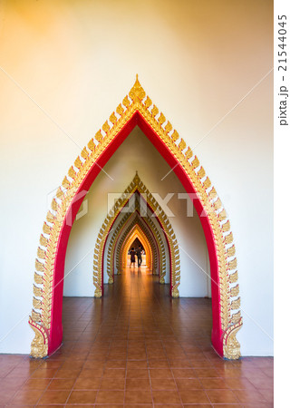 Lovely couple walk through beautiful arch doors 21544045