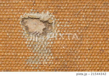 Detail (damage) of an old canvas suitcase 21544342