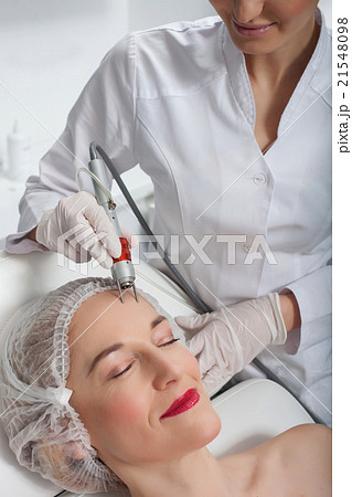 Pretty mature lady is having laser therapy Pretty mature lady is having laser therapy 21548098