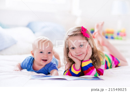 Kids reading in white bedroom Kids reading in white bedroom 21549025