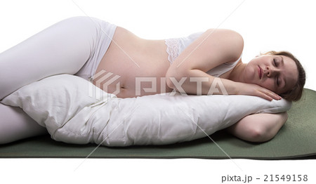 Pregnant young sleeping woman and cushion Pregnant young sleeping woman and cushion 21549158