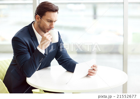Handsome man drinking coffee 21552677