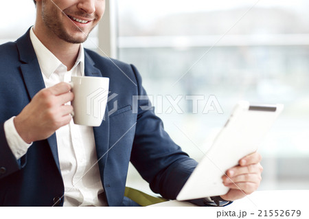 Cheerful man drinking coffee 21552679