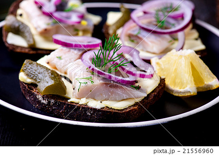 Sandwich with butter, herring, red onion Sandwich with butter, herring, red onion 21556960