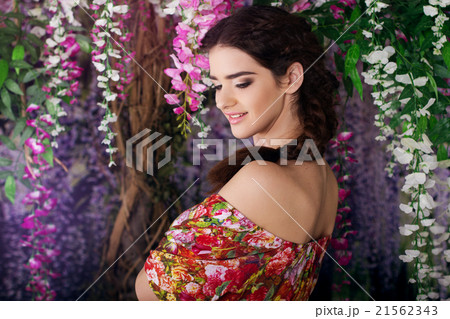 Pretty girl in magic wistaria garden Pretty girl in magic wistaria garden 21562343
