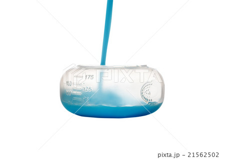 Blue Conditioner Pouring in Measure Cup Blue Conditioner Pouring in Measure Cup 21562502
