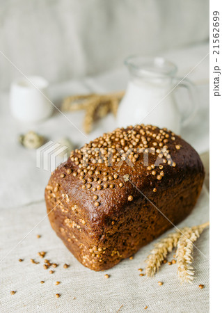 Sliced bread with fresh coriander and milk Sliced bread with fresh coriander and milk 21562699