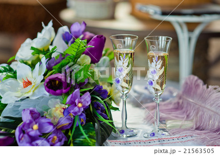 Pair of wedding wineglasses on the table 21563505