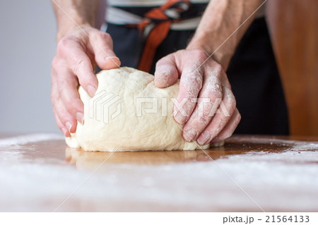 Baker makes bread on the table Baker makes bread on the table 21564133