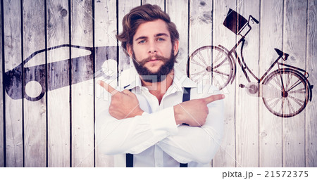 Composite image of confident hipster pointing sideways with arms crossed Composite image of confident hipster pointing sideways with arms crossed 21572375