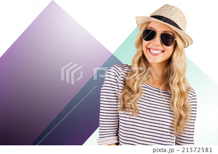 Composite image of gorgeous smiling blonde hipster with sunglasses and straw hat 21572581