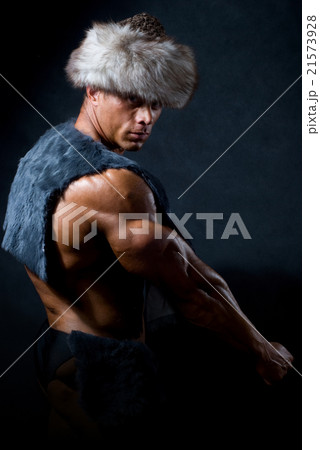 Strong athletic man in a fur cap Strong athletic man in a fur cap 21573928