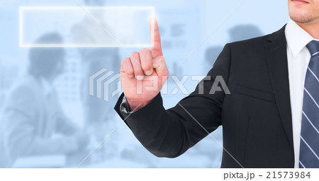 Composite image of unsmiling businessman pointing his finger 21573984