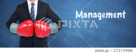 Composite image of businessman with boxing gloves Composite image of businessman with boxing gloves 21573986