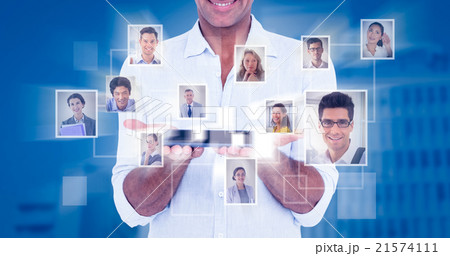 Composite image of portrait of smiling man showing tablet comput 21574111