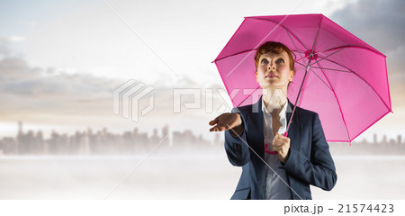Composite image of businesswoman with umbrella Composite image of businesswoman with umbrella 21574423