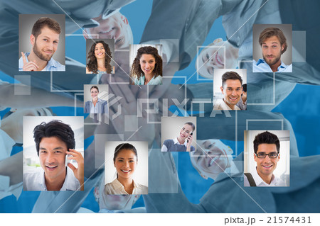 Composite image of business team standing hands together 21574431