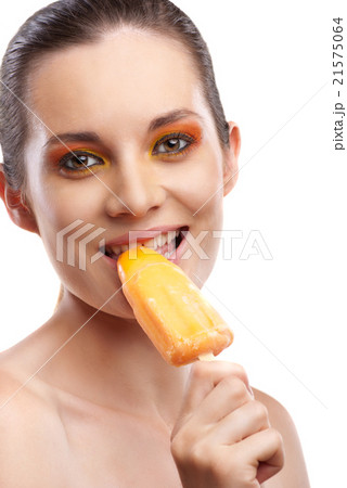 Woman eating orange ice-cream and having fun 21575064