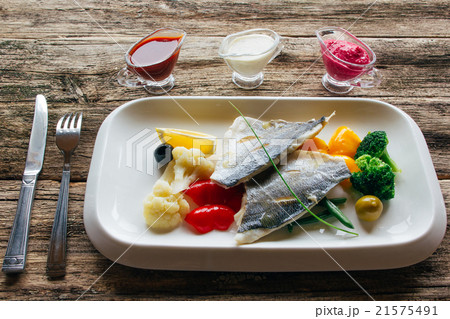Stewed dorado fillet with vegetables and sauces Stewed dorado fillet with vegetables and sauces 21575491