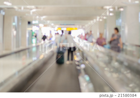 Blurred people through an escalator. 21580384