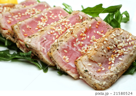 meat slices tuna with sesame seeds and herbs 21580524