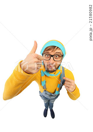 a man in a yellow sweater and overalls 21580982