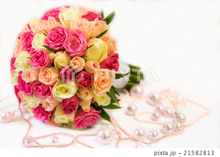 A wedding round bouquet with pink and yellow roses 21582813