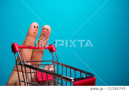 Funny fingers shopping at supermarket with red 21583745