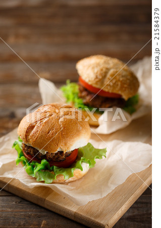 Homemade hamburgers and french fries on wooden 21584379
