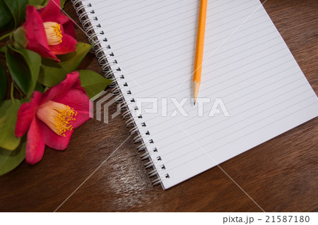 Notebooks and pensil with romantic pink flowers Notebooks and pensil with romantic pink flowers 21587180