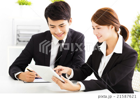 happy business man and woman working  in office 21587621