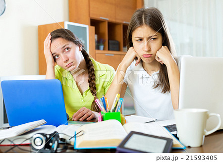 Two melancholy female students 21593405