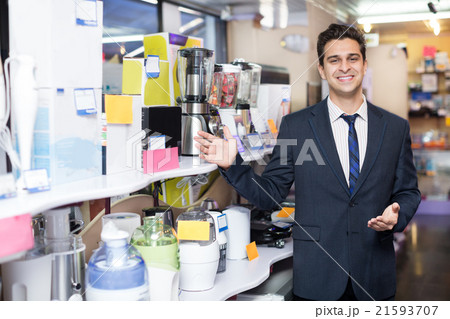 Male seller at household appliances section Male seller at household appliances section 21593707