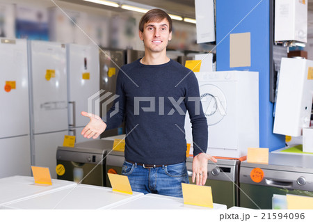 man at household appliances store man at household appliances store 21594096