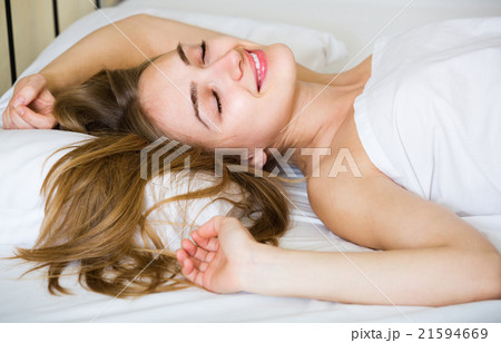 Portrait of pretty girl awake in bed. 21594669