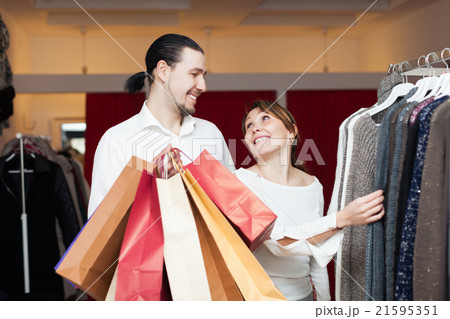 Two buyers with shopping bags at shop 21595351