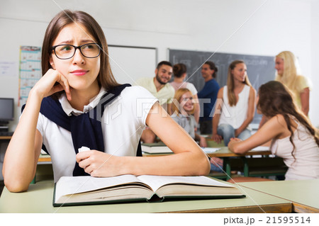 Lonely sad student in the classroom Lonely sad student in the classroom 21595514