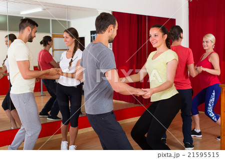 Young adults dancing in a studio. 21595515