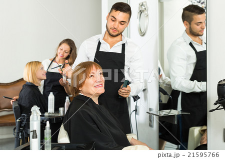 Mature woman in the barbershop. Mature woman in the barbershop. 21595766