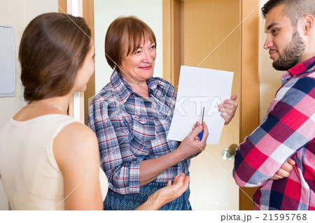 Woman and young family at door Woman and young family at door 21595768