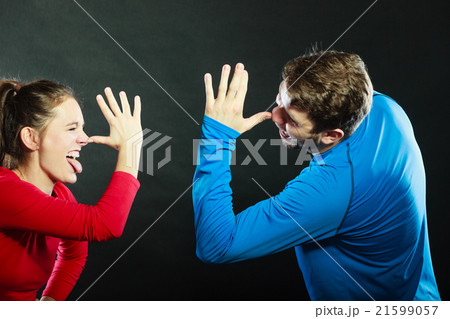 Happy couple mocking having fun playing the fool. Happy couple mocking having fun playing the fool. 21599057