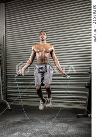 Shirtless man jumping the rope Shirtless man jumping the rope 21599280
